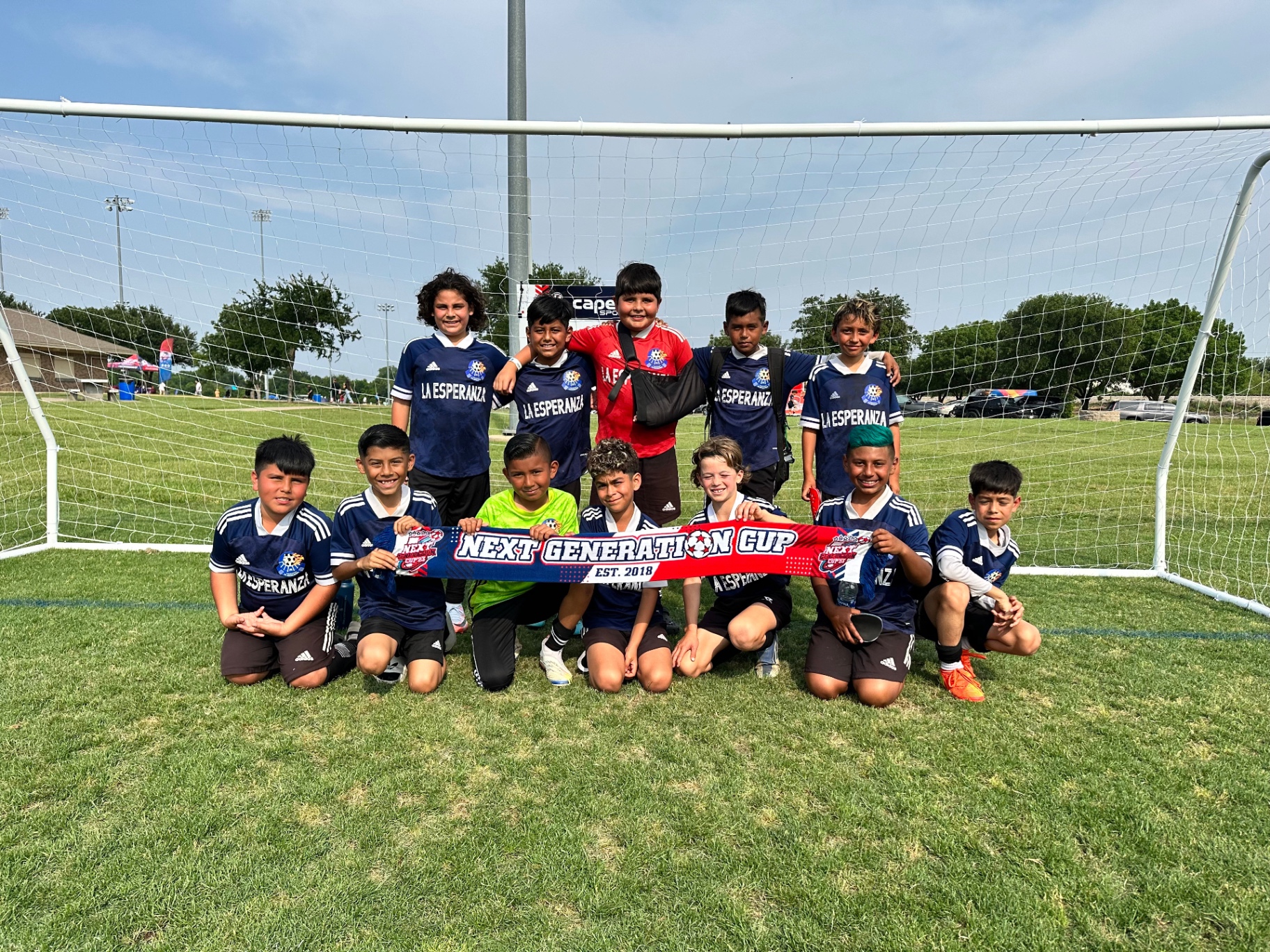 Young La Esperanza team celebrating at the Next Generation Cup