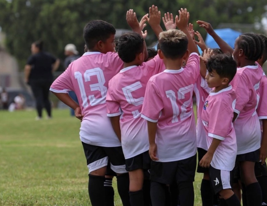 Young players high-fiving before a match