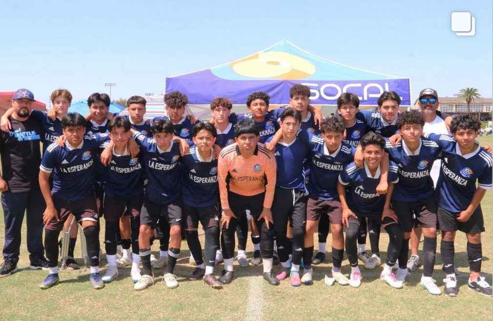 La Esperanza squad gathered beneath the SOCAL tent