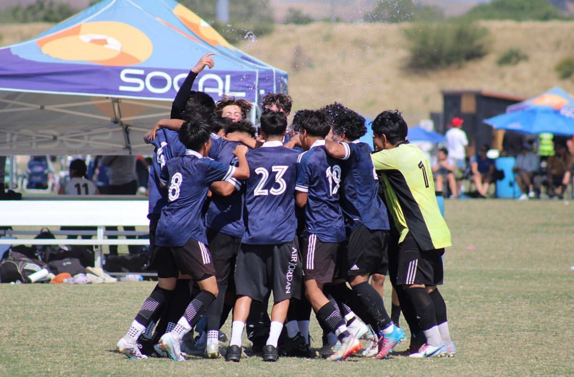 La Esperanza team huddled together after a match