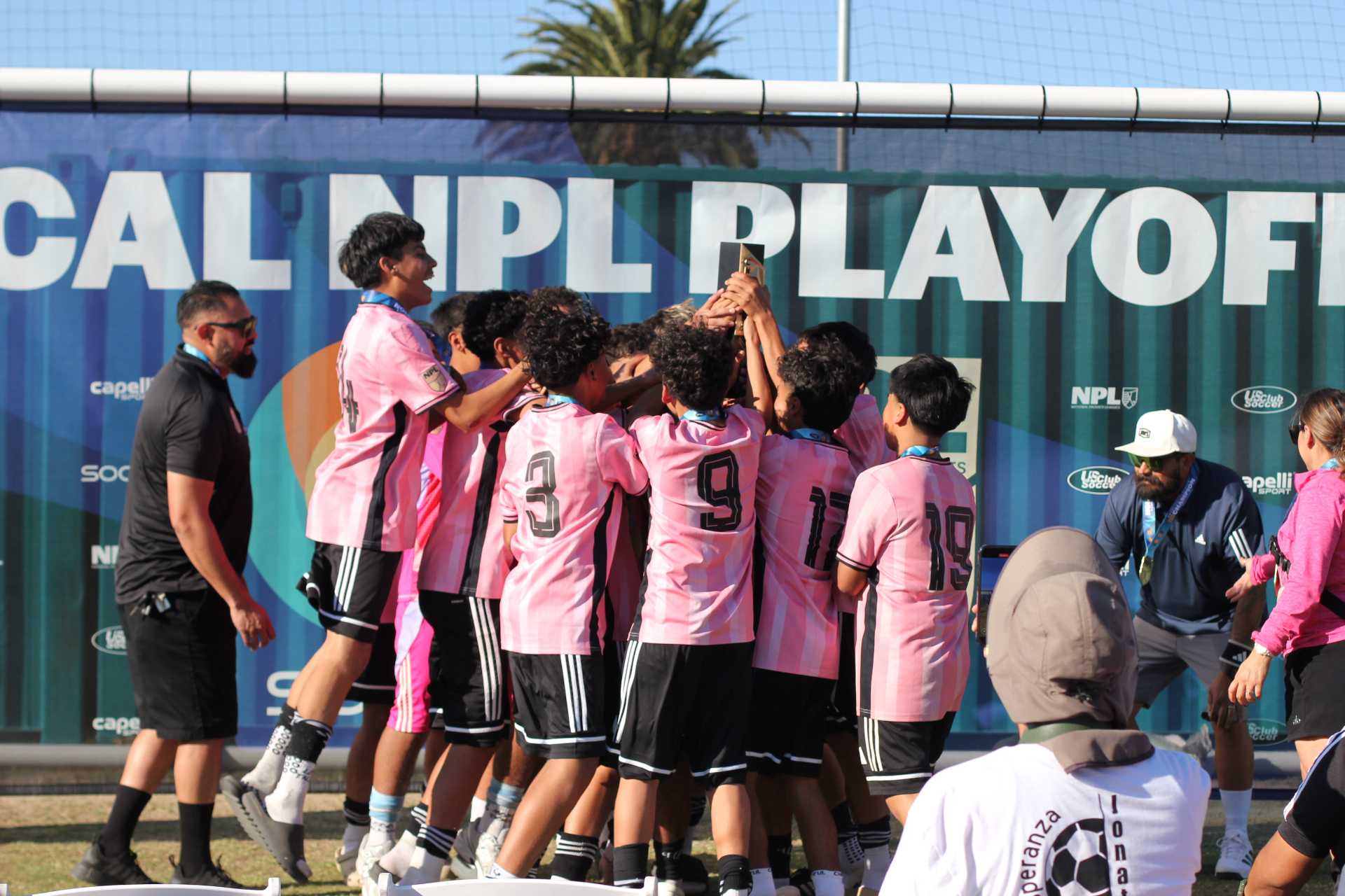 La Esperanza players celebrating a championship at the SOCAL NPL Playoffs