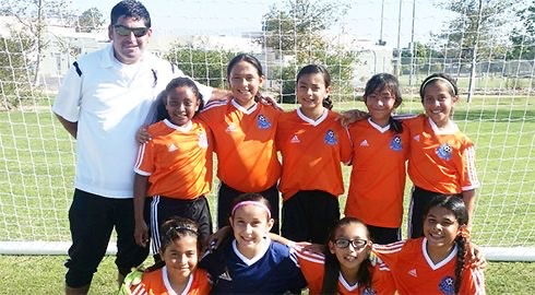 La Esperanza girls team with their coach